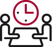 Two figures sitting at a table beneath a clock, representing a scheduled meeting or discussion.