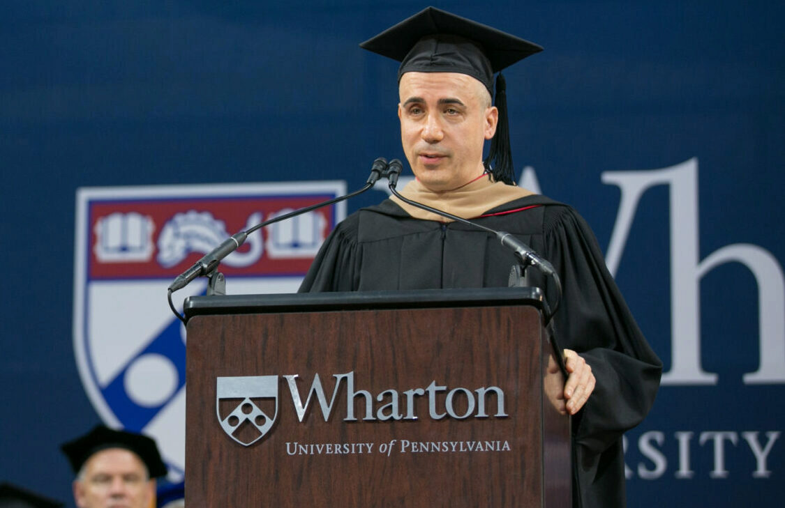 Yuri Milner speaking at lectern during Wharton Commencement