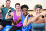 Senior African-American woman taking exercise class