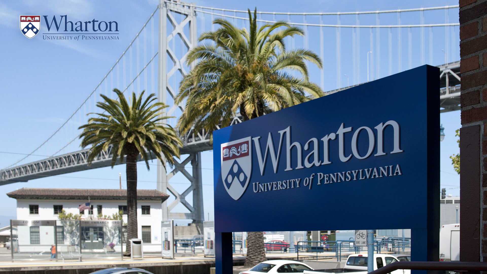 Wharton San Francisco Sign with a bridge in the background