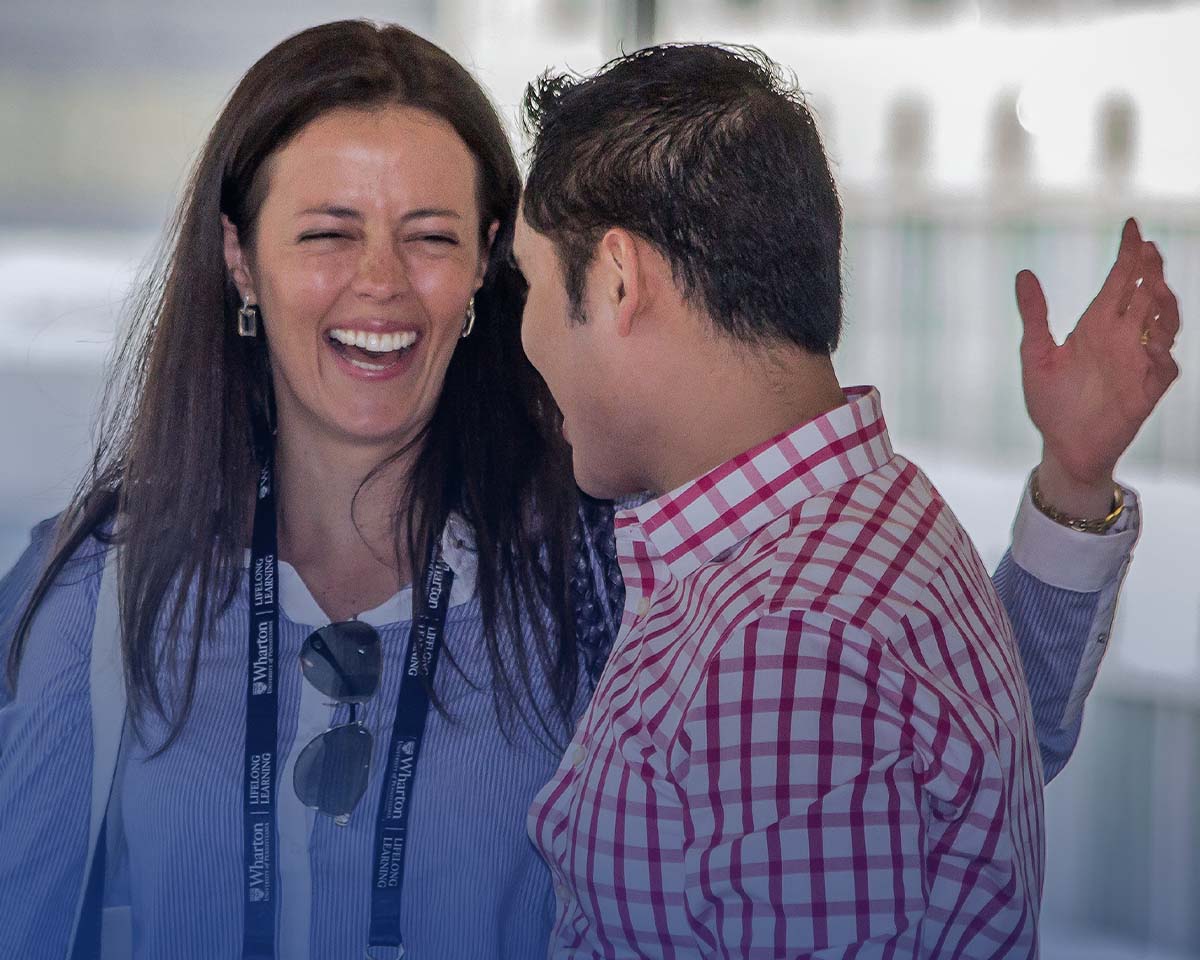 Wharton alumni laughing together at a Wharton Circles event