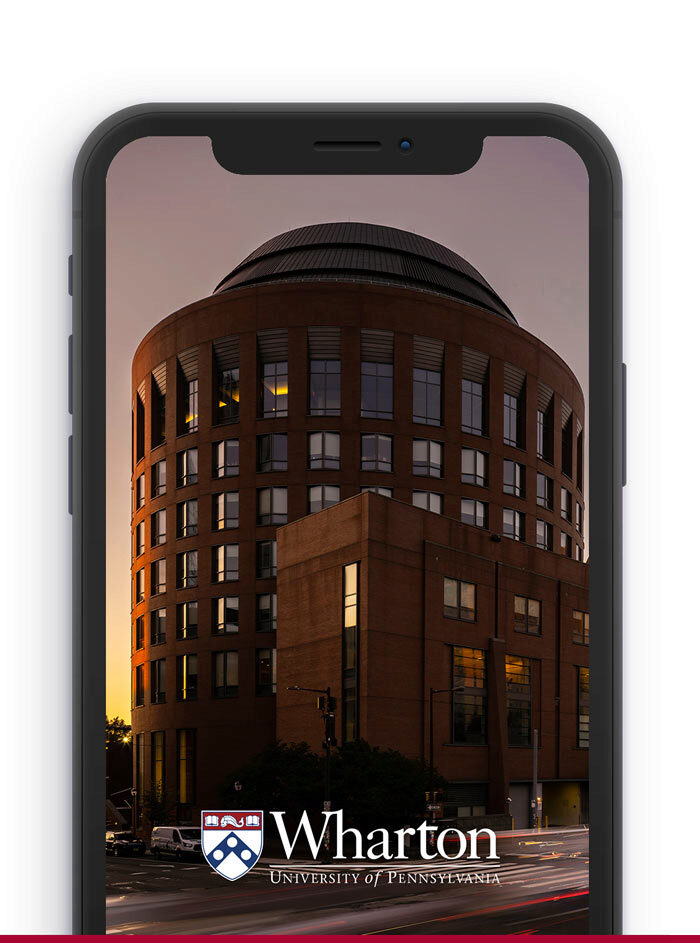 Mobile phone with Jon M. Huntsman Hall at Dusk background