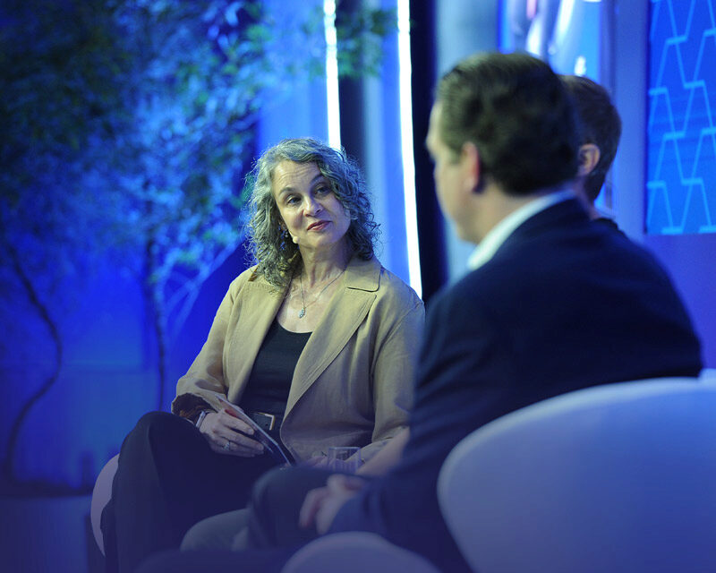 Panelists on stage at a Global Forum session