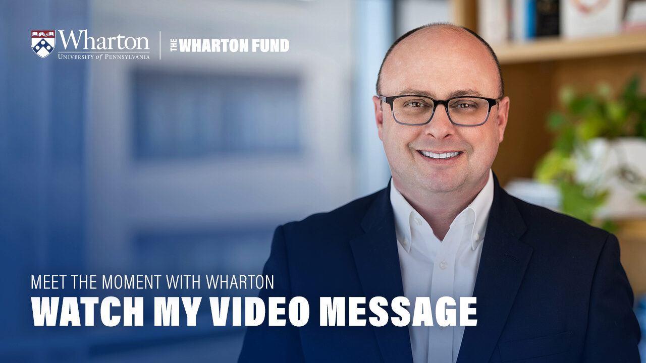 Bill Bole in a navy suit and glasses smiling in an office setting with Wharton branding. "Watch My Video Message"