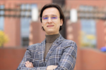 Piotr Lazarek, ENG’25, W’25, wears a checkered blazer and glasses while standing outdoors with his arms crossed, with a brick building in the background.A scholarship student and alumnus of Venture Lab’s competitive VIP-X accelerator, Piotr Lazarek, ENG’25, W’25, was recently awarded the President’s Sustainability Prize for his venture, Nirby.