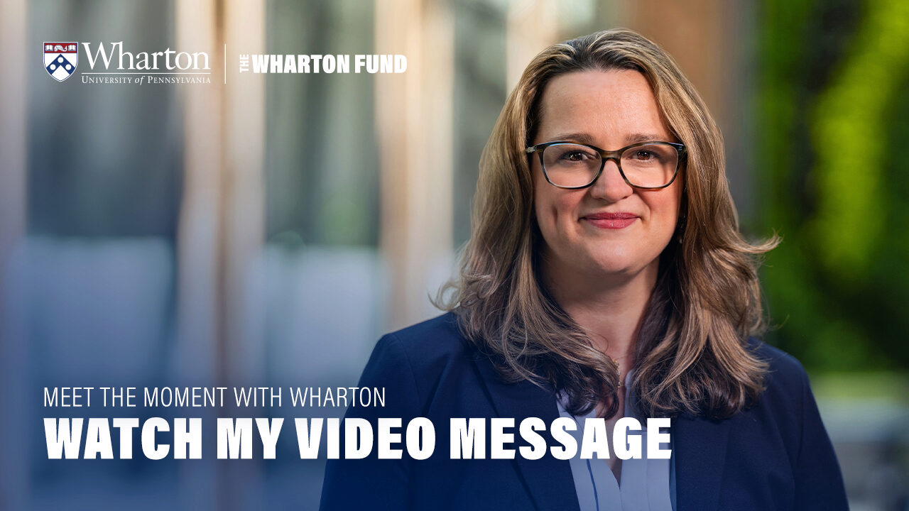 Colleen O'Neill in a dark blazer smiling outdoors with a blurred background of greenery and glass. "Watch My Video Message"