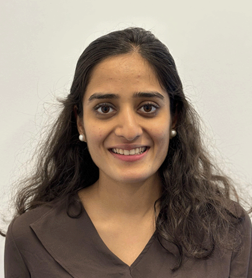 Riddhi Sampat with long hair and smiling