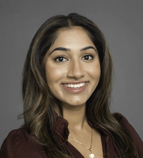 Shloka Parvatrao with long hair and smiling