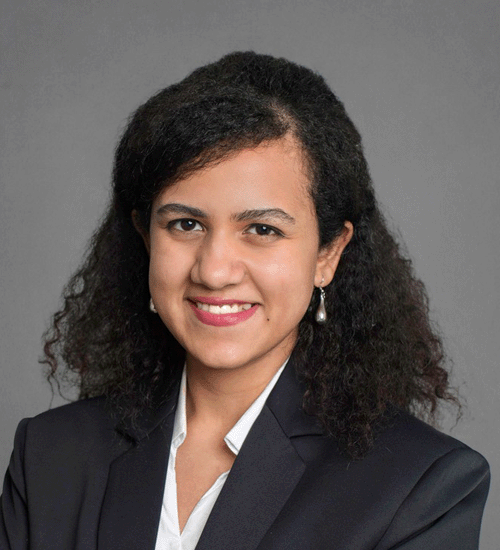 Tiyasha Mitra with curly hair and smiling